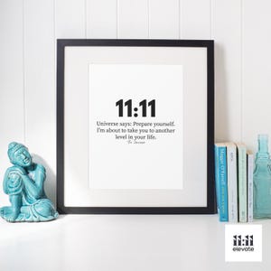 May include: A black framed print with the number 11:11 in large bold font. The text below reads "Universe says: Prepare yourself. I'm about to take you to another level in your life. The Universe"