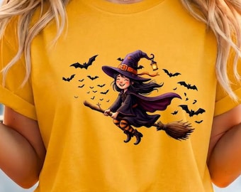 Camiseta de bruja adorable en escoba | Diseño de bruja para niños de Halloween