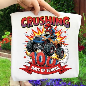 May include: White tote bag with a colorful graphic of a monster truck with a Spider-Man character on top. The text "CRUSHING 100 DAYS OF SCHOOL" is displayed in bold letters on the bag.