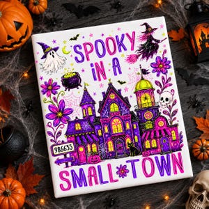 May include: A white rectangular canvas print featuring a purple and pink haunted house illustration with the text "SPOOKY IN A SMALL TOWN". The design includes a ghost, a witch on a broom, a skull, a black cat, flowers, and a sign reading 986635.
