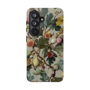 May include: A phone case with a botanical fig design. The case shows a detailed illustration of fig branches with ripe figs, leaves, and flowers in shades of green, yellow, and purple against a neutral background. The case has a camera module.