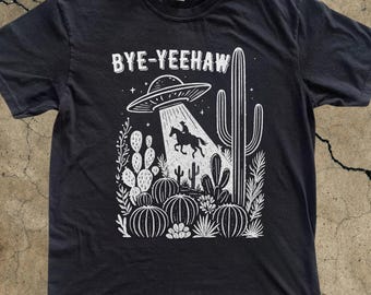 ハウディウエスタンカウUFO Tシャツ、ヴィンテージ90年代シャツ、ウォッシュドシャツ、ワイルドウェストシャツ、ヴィンテージカウボーイエイリアンTシャツ、カウボーイギフト、レトロエイリアンシャツ