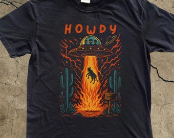 ハウディウエスタンカウUFO Tシャツ、ヴィンテージカウボーイエイリアンTシャツ、ヴィンテージ90年代シャツ、ウォッシュドシャツ、ワイルドウェストシャツ、カウボーイギフト、レトロエイリアンシャツ