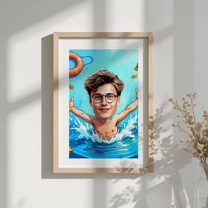 May include: A framed cartoon illustration of a person swimming in blue water, arms outstretched. The person is wearing glasses and has brown hair. A life preserver and fish are in the background. The frame is light brown.
