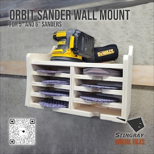 May include: A wooden orbit sander wall mount with multiple shelves for sander discs. The mount holds a yellow and black sander and a black bag with the word "DEWALT" on it. The text "ORBIT SANDER WALL MOUNT" is at the top.