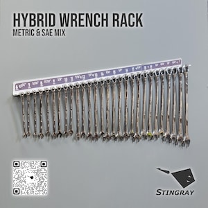 May include: A hybrid wrench rack displaying a selection of metric and SAE wrenches. The rack is labeled with sizes in inches. The text "HYBRID WRENCH RACK METRIC & SAE MIX" is at the top. The brand name "STINGRAY" is at the bottom.
