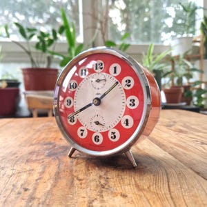 Vintage Prim mechanical alarm clock, Czechoslovakia 1960s-70s, red/orange in pop art design, fully functional