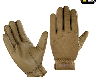 May include: A pair of tan tactical gloves. The gloves have a leather palm and finger area, with a breathable mesh back. The wrist area is elasticized. The M-TAC logo is visible on the wrist. The gloves are designed for outdoor activities.