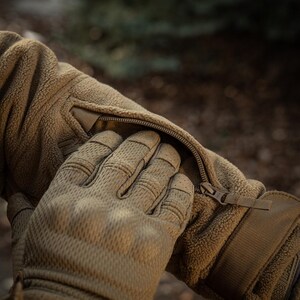Sleeve pocket and Velcro panels on fleece jacket