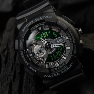 M-Tac Sport Black tactical watch with matte stealth finish and digital display.