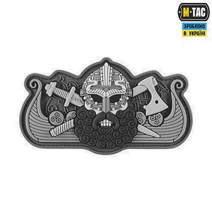 May include: A gray and black embroidered patch depicting a Viking warrior with a horned helmet, crossed swords, and axes. The patch is surrounded by a stylized ship design. The text "M-TAC" and "ЗРОБЛЕНО В УКРАЇНІ" is visible on the patch.