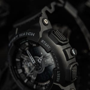Close-up of M-Tac black polycarbonate case and impact resistant crystal