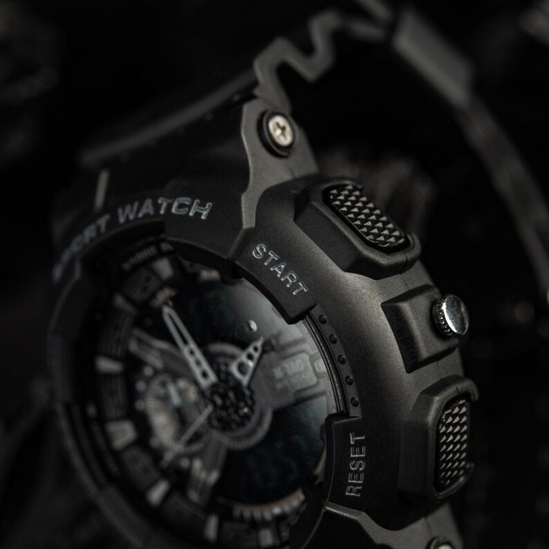 Close-up of M-Tac black polycarbonate case and impact resistant crystal