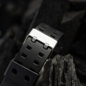 All-black tactical EDC watch for men, shock-resistant and built for rugged conditions.