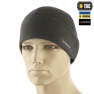 May include: A dark gray fleece beanie with a rounded crown. The hat features a small red and white logo on the side and is made of Polartec material. The M-TAC logo and text are visible in the upper right corner.