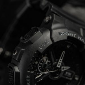 Tactical digital watch on a black silicone strap for professional use.