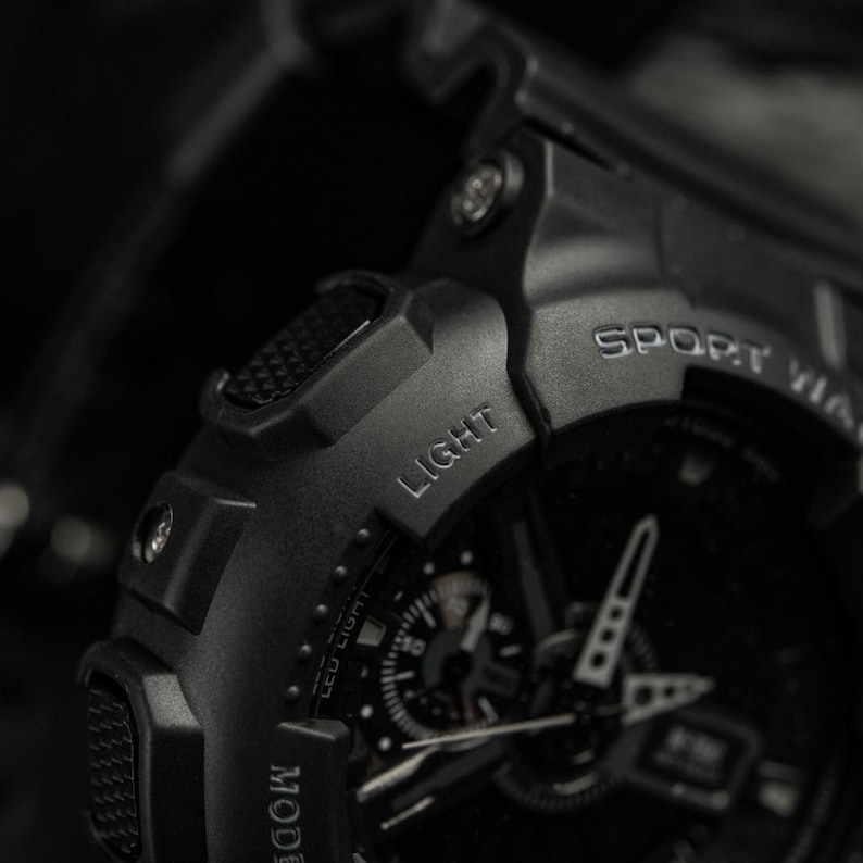Tactical digital watch on a black silicone strap for professional use.
