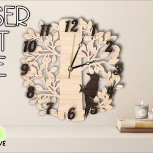 May include: Laser cut file for a wooden clock featuring a tree with leaves and a bird. The clock face has Roman numerals and the numbers 1-12. The file is available in DXF, CDR, PDF, SVG, and AI formats.