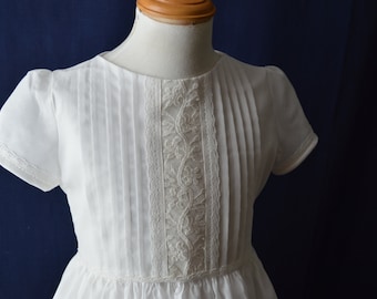 Classic holy communion dress for girls made with fine swiss cotton and embellished with  fine  hand embroidery work and lace