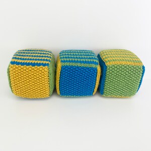 set of knit blocks with stripes and solid sides in green, yellow and blue