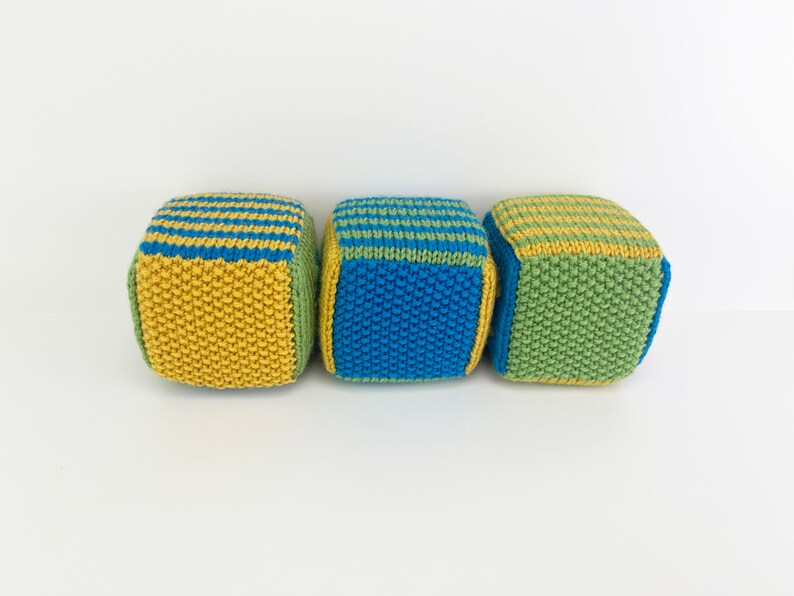 set of knit blocks with stripes and solid sides in green, yellow and blue
