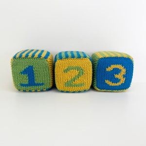 set of knit blocks with numbers 1, 2 and 3 in green, yellow and blue