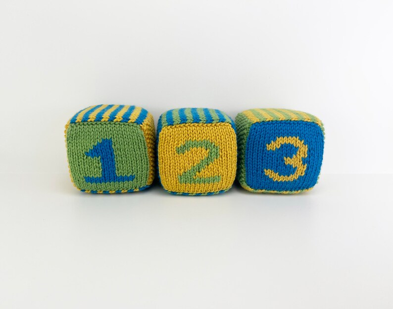 set of knit blocks with numbers 1, 2 and 3 in green, yellow and blue