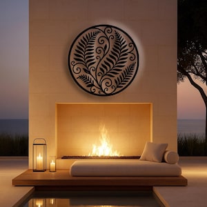 May include: A black metal wall art piece with a fern design is mounted on a beige stone wall above a fireplace. A modern outdoor living space features a lounge area with a fire, candles, and a small pool.
