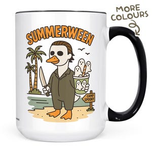 May include: White ceramic mug with a black handle and rim. The mug features a cartoon illustration of a duck dressed as a horror movie character, holding a knife and a cup of ghosts. The text "SUMMERWEEN" is above the duck.