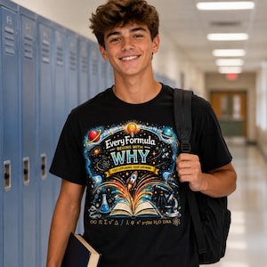 May include: A black t-shirt featuring a colorful graphic print of an open book with a rocket launching from its pages, surrounded by planets, a lightbulb, a microscope, and the text "Every Formula BEGINS WITH WHY KEEP EXPLORING KEEP GROWING".