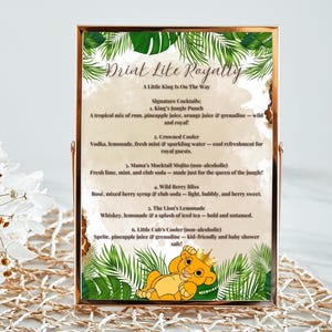May include: A printable sign with a jungle theme, featuring a cartoon lion cub. The sign lists different drink options for a party, including "King's Jungle Punch", "Crowned Cooler", "Mama's Mocktail Mojito", "Wild Berry Bliss", "The Lion's Lemonade", and "Little Cub's Cooler". The text "Drink Like Royalty" is at the top of the sign.