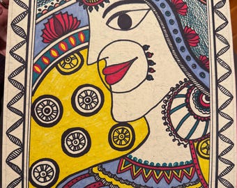 May include: Colorful folk art illustration of a woman's face, featuring intricate patterns and designs. The artwork showcases a yellow background with circular motifs, a blue and red striped garment, and a decorative border. The woman's face is detailed with red lips and a nose ring.