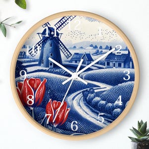 May include: Round wall clock with a light wood frame. The clock face features a blue and white landscape scene with a windmill, houses, and red tulips. White clock hands and numbers complete the design.