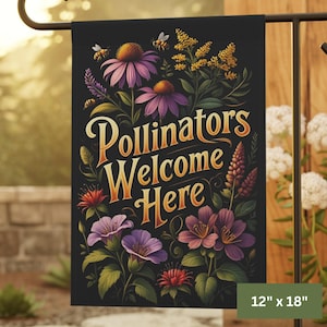 May include: A black garden flag with the text "Pollinators Welcome Here" in gold script, surrounded by colorful flowers and bees. The flag measures 12 x 18 inches.