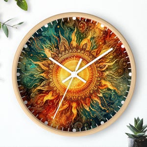May include: Round wall clock with a wooden frame. The clock face features a vibrant sun design in shades of yellow, orange, teal, and brown. White clock hands indicate the time. The clock is a decorative item for home decor.