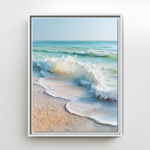 May include: A framed wall art print featuring an oil painting of a turquoise ocean wave crashing onto a sandy beach. The scene captures the white sea foam, the translucent blue water, and the textured sand in a realistic, painterly style.