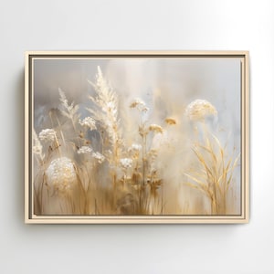 May include: A framed canvas print featuring a soft, impressionistic painting of tall grasses and wildflowers in shades of beige, cream, and gold. The artwork has a neutral color palette and a blurred, dreamy quality.