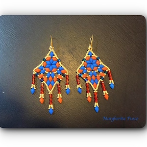 May include: A pair of blue, orange, and gold beaded earrings with a geometric design and dangling beads.