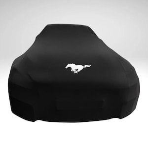 May include: Black car cover with a white running horse logo.