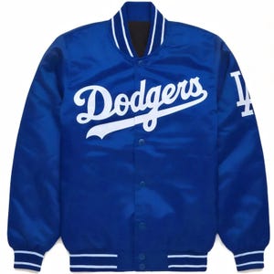 May include: A royal blue satin baseball jacket with white "Dodgers" lettering and a white "LA" logo on the sleeve.