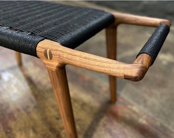 Walnut bench with woven seat