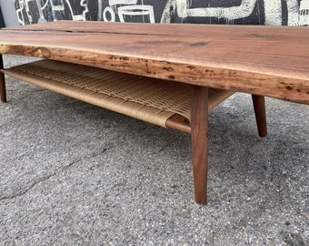 Live edge coffee table with woven shelf