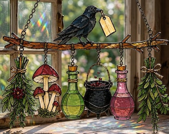 May include: A stained glass suncatcher featuring a black crow perched on a branch, holding a blank tag. Hanging from the branch are two bundles of green herbs, a cluster of red-capped mushrooms, a green potion bottle, and a pink potion bottle.