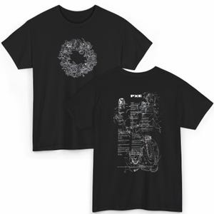 May include: Black t-shirts with white graphic designs. One shirt features a floral wreath, the other has a detailed illustration with the text "PXE". The shirts are made of a soft material and have a classic crew neck.