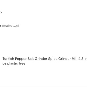 May include: A cylindrical metal spice grinder mill featuring an intricate embossed pattern across its surface. The grinder stands 4.3 inches tall and weighs 0.5 ounces. The design includes a rounded base and a top adjustment knob for grinding.