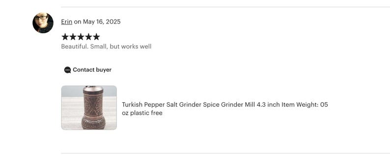 May include: A cylindrical metal spice grinder mill featuring an intricate embossed pattern across its surface. The grinder stands 4.3 inches tall and weighs 0.5 ounces. The design includes a rounded base and a top adjustment knob for grinding.