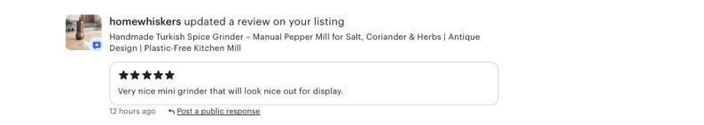 May include: A digital notification showing a five-star review for a handmade Turkish spice grinder. The text reads: homewhiskers updated a review on your listing, Handmade Turkish Spice Grinder - Manual Pepper Mill for Salt, Coriander & Herbs.