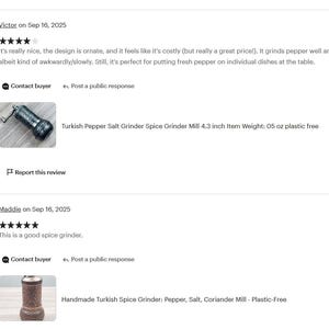 May include: A dark-colored, cylindrical Turkish spice grinder with a metal hand crank on top. The body features an intricate, embossed pattern and a rounded base. The product is labeled as a 4.3 inch, 5 ounce, plastic-free pepper and salt mill.