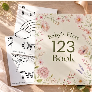 May include: A baby's first 123 book with floral illustrations and the text "Baby's First 123 Book." Two coloring pages with numbers and illustrations are also visible. The book and pages are decorated with flowers.