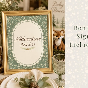 Woodland baby shower bonus printable sign featuring an “Adventure Awaits” woodland decor sign in a gold frame with rustic forest-themed baby shower styling. Printable woodland baby shower sign with watercolor greenery, woodland animals, and neutral baby shower decor. Bonus printable included with woodland ABC book keepsake activity for a gender neutral baby shower.
